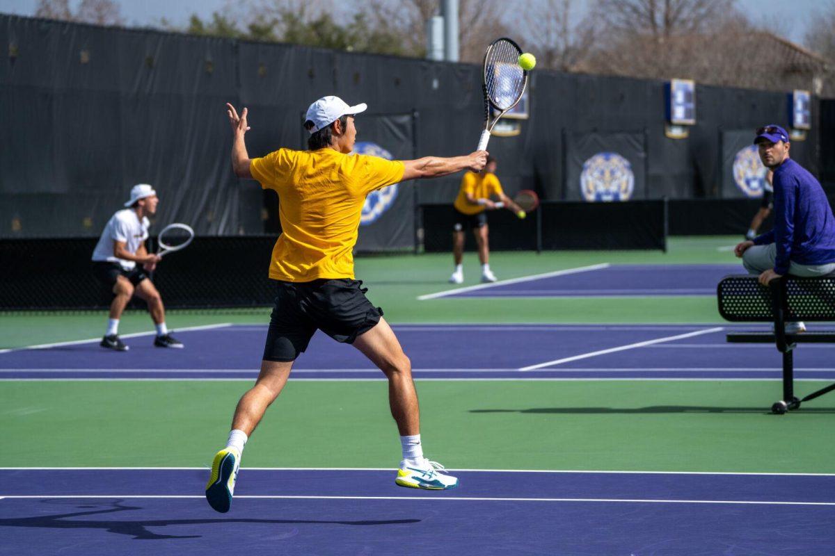 LSU men's tennis senior Chen Dong hits a volley during his 5-7, 6-3, 6-2 singles win against Rice on Sunday, Feb. 4, 2023 at the LSU Tennis Complex on Gourrier Avenue in Baton Rouge, La.