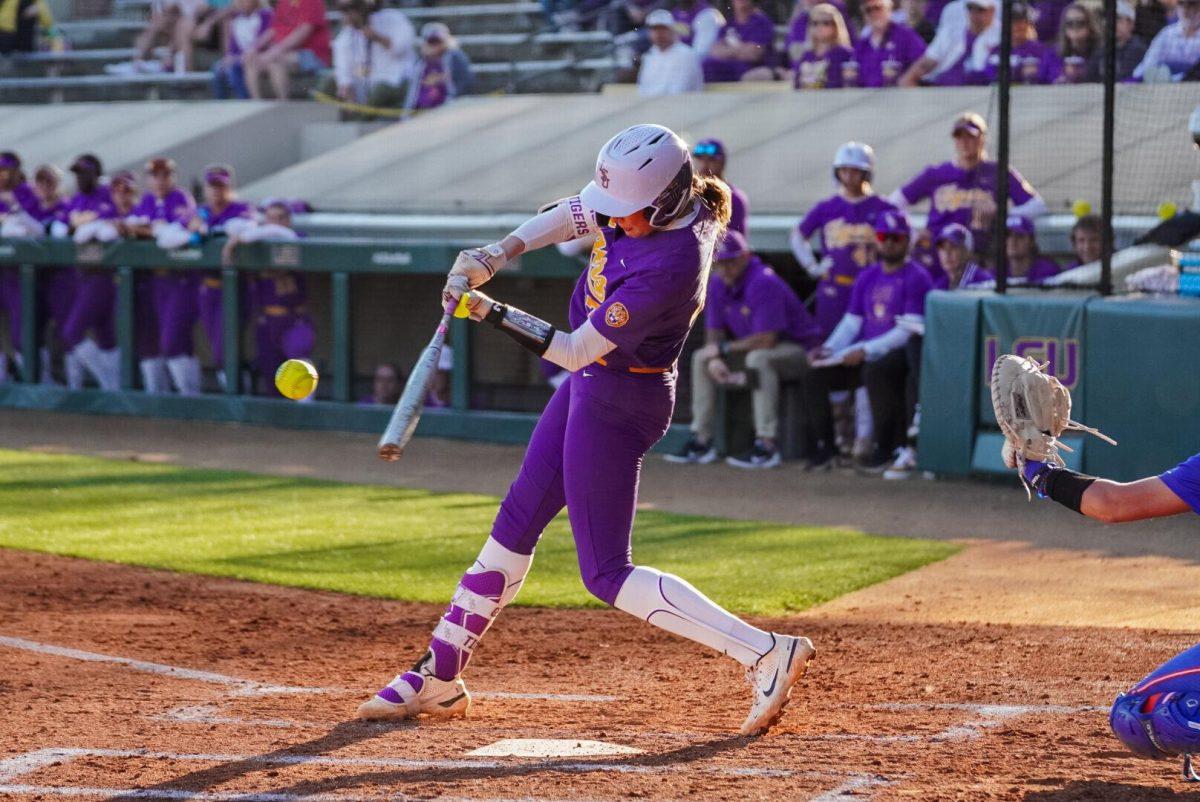 LSU softball graduate student infielder Taylor Pleasants (17) swings for the ball Friday, Feb. 23, 2024, during LSU&#8217;s game against Boise State in Tiger Park in Baton Rouge, La.