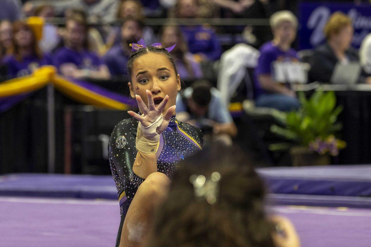 LSU gymnastics junior all-around Aleah Finnegan gasps at her hand Friday, Feb. 16, 2024, during LSU's win 198.300-197.10 against Auburn in the Pete Maravich Assembly Center.