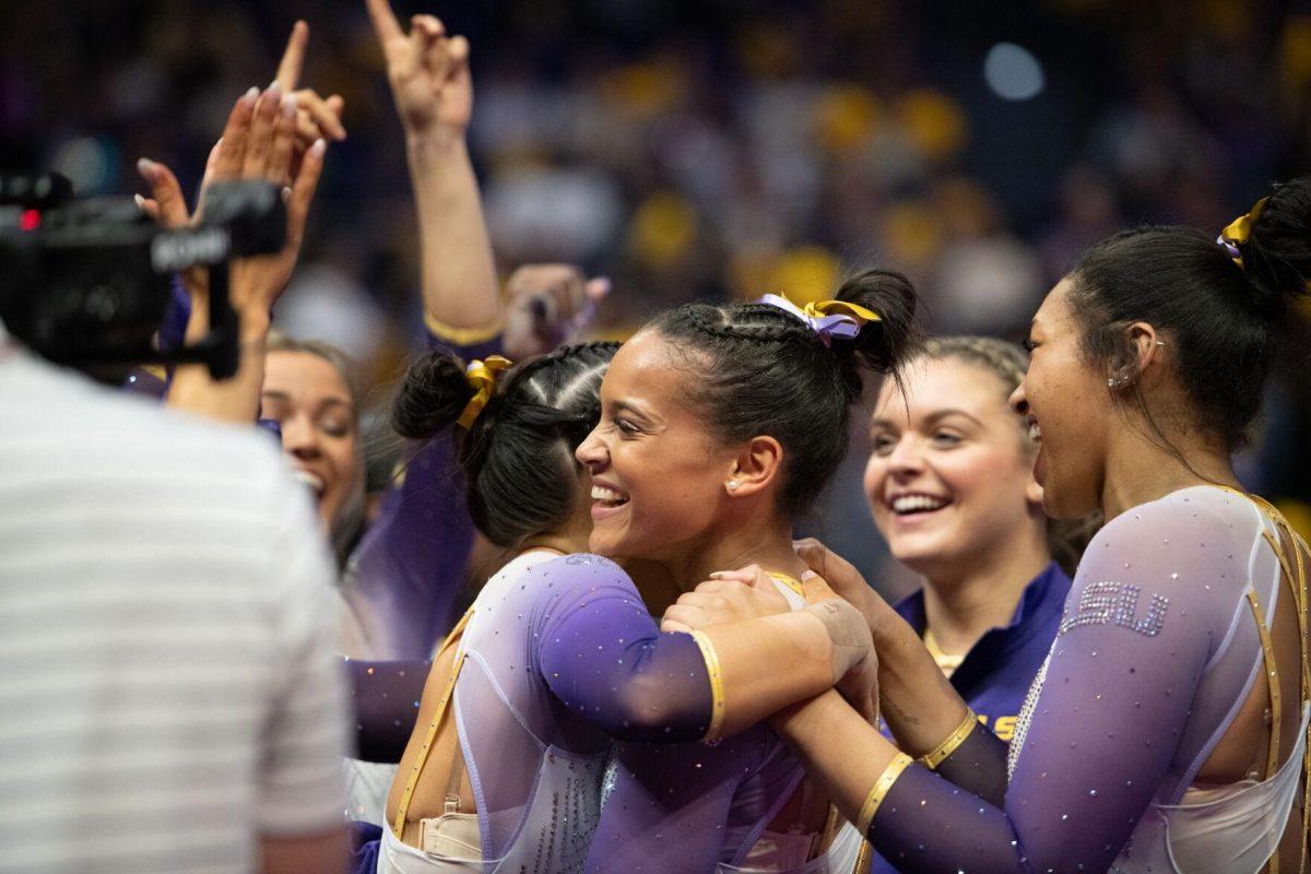 LSU gymnastics all-around senior Haleigh Bryant and her teammates celebrate a 10 Friday, Feb. 2, 2024, during LSU&#8217;s 198.475-196.200 win against Arkansas at the Pete Maravich Assembly Center in Baton Rouge, La.