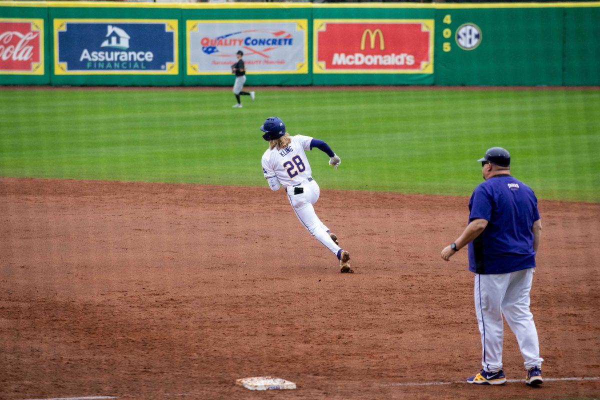 LSU baseball sophomore outfielder Paxton Kling (28) runs the bases after his hit during LSU's 11-8 win against VMI on Friday, Feb. 16, 2024, at Alex Box Stadium in Baton Rouge, La.