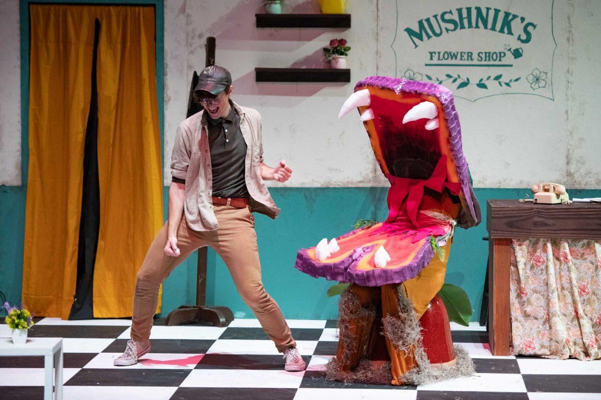 LSU psychology junior Thomas Becnel dances with graphic design and theatre freshman Carly Mershon (puppetting Audrey II) Thursday, Feb. 1, 2024, during LSU Musical Theatre Club's performance of "Little Shop of Horrors" at the Reilly Theatre in Baton Rouge, La.