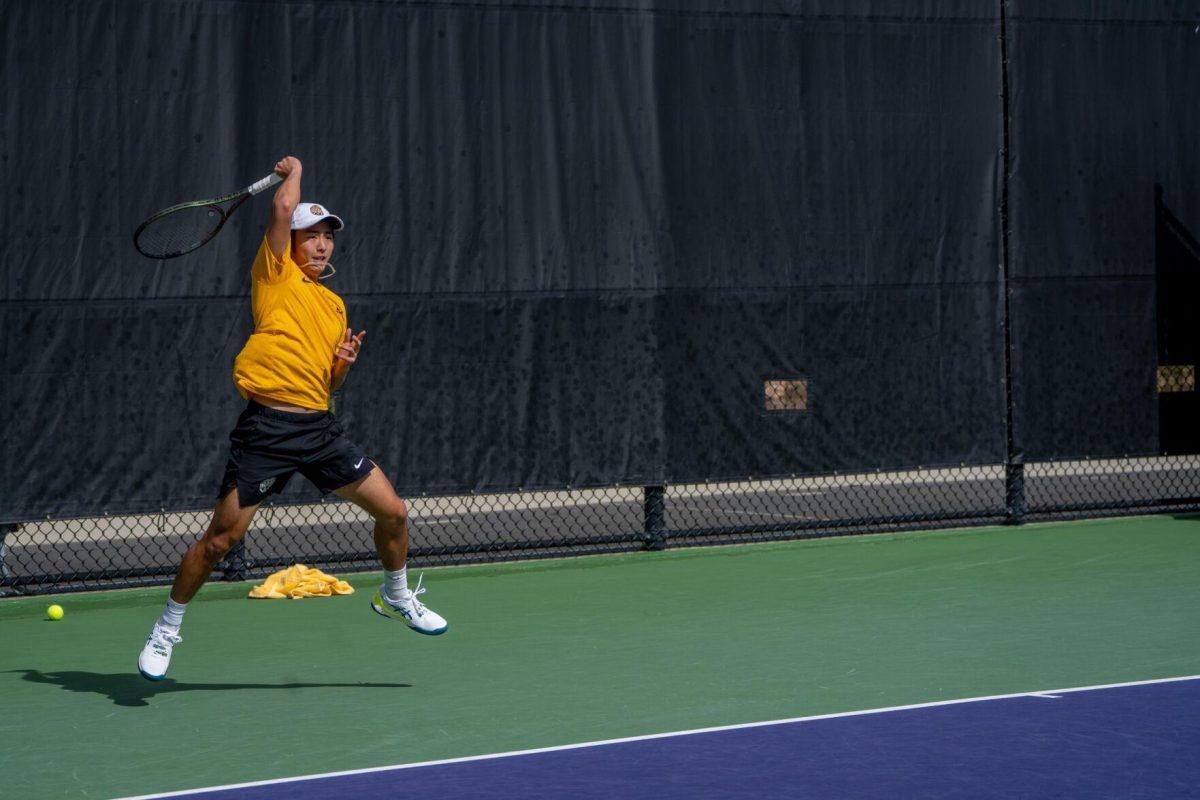 LSU men's tennis senior Chen Dong hits a forehand during his 5-7, 6-3, 6-2 singles win against Rice on Sunday, Feb. 4, 2023 at the LSU Tennis Complex on Gourrier Avenue in Baton Rouge, La.