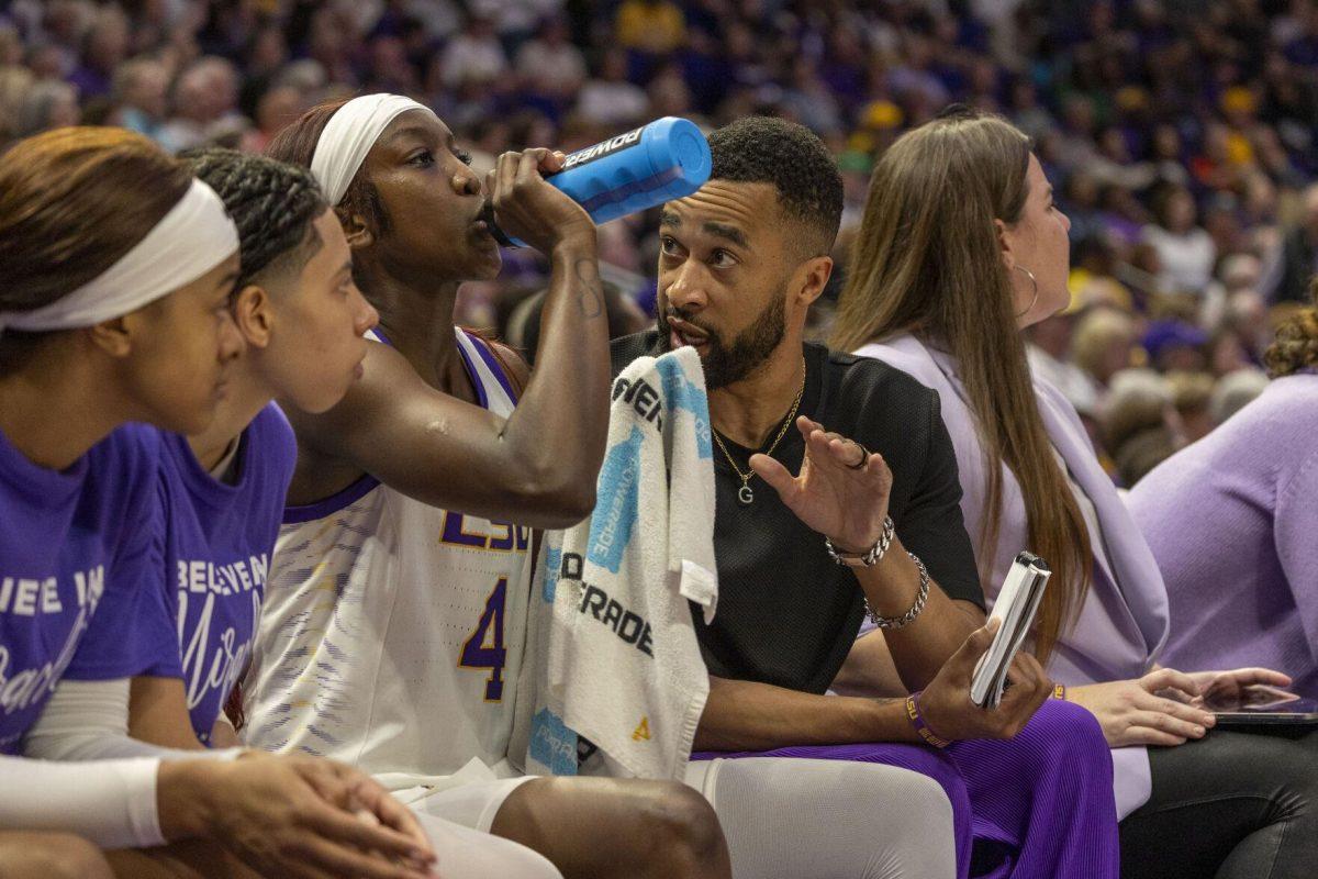 LSU women's basketball assistant coach Gary Redus II gives comments to sophomore guard Flau'jae Johnson (4) Thursday, Feb. 22, 2024, during LSU's 71-66 win over Auburn Pete Maravich Assembly Center in Baton Rouge, La.
