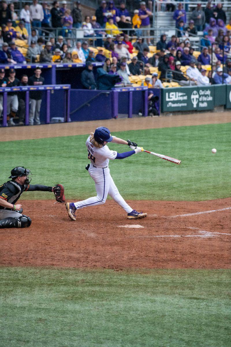 LSU baseball sophomore outfielder Paxton Kling (28) hits the ball during LSU's 11-8 win against VMI on Friday, Feb. 16, 2024, at Alex Box Stadium in Baton Rouge, La.