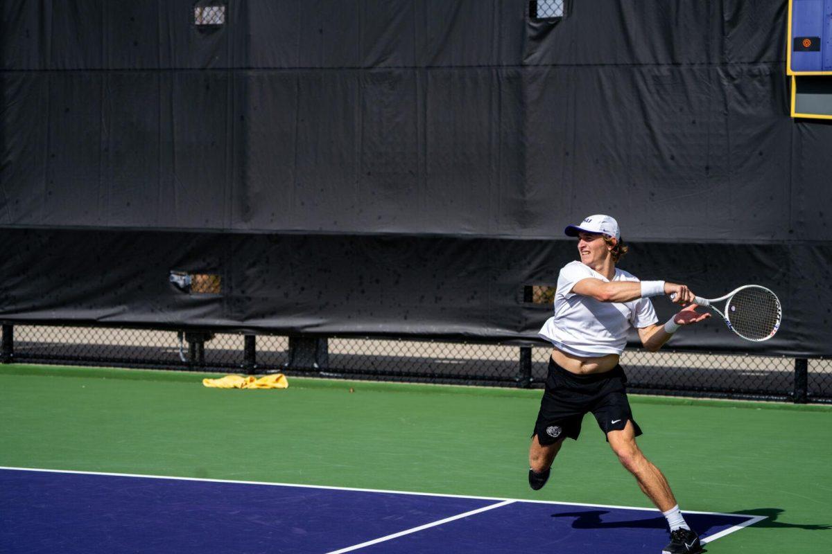 LSU men's tennis 5th-year senior George Stoupe hits a forehand during his 6-3, 3-6, 6-1 singles win against Rice Sunday, Feb. 4, 2023 at the LSU Tennis Complex on Gourrier Avenue in Baton Rouge, La.