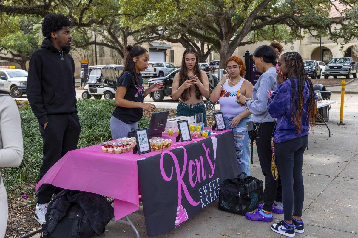 Visitors stop by Ken's Sweet Kreat table Thursday, Feb. 8, 2024, during the BSU and Let's Link Pop Up Shop in Free Speech Alley.