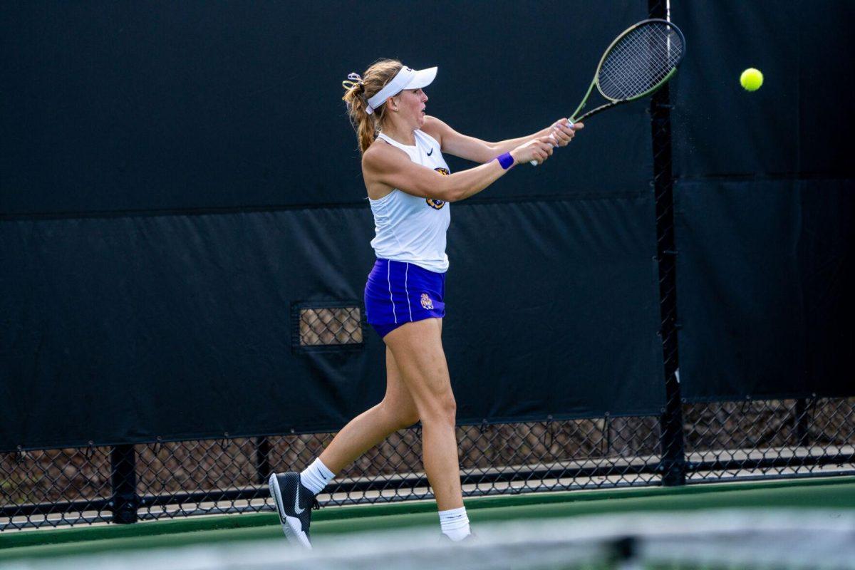 LSU women's tennis freshman Kenna Erickson hits a backhand during her 6-0, 6-4 singles win against Rice Sunday, Feb. 4, 2023 at the LSU Tennis Complex on Gourrier Avenue in Baton Rouge, La.