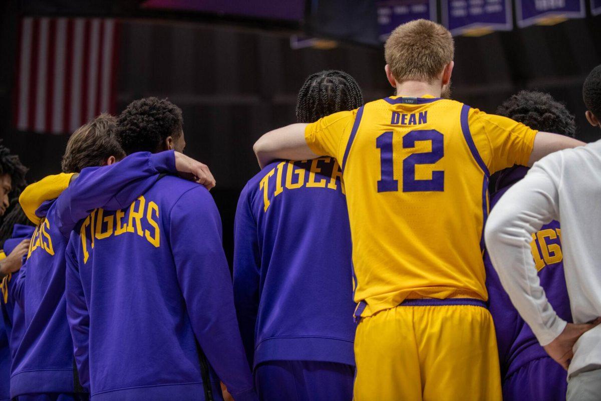 LSU men's basketball team members huddle up on Saturday, Feb. 3, 2024, during LSU's 94-74 win against Arkansas in the Pete Maravich Assembly Center in Baton Rouge, La.