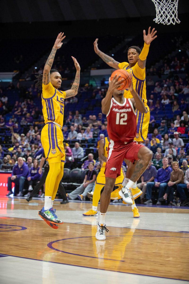 LSU men's basketball sophomore forward Tyrell Ward (15) and senior forward Derek Fountain (20) jump to block the ball on Saturday, Feb. 3, 2024, during LSU's 94-74 win against Arkansas in the Pete Maravich Assembly Center in Baton Rouge, La.