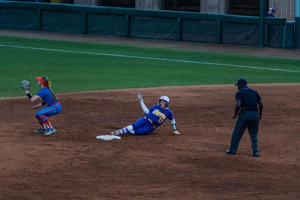 LSU softball graduate student infielder Taylor Pleasants (17) slides into second base Friday, Feb. 23, 2024, during LSU&#8217;s 8-5 win over Boise State at Tiger Park in Baton Rouge, La.