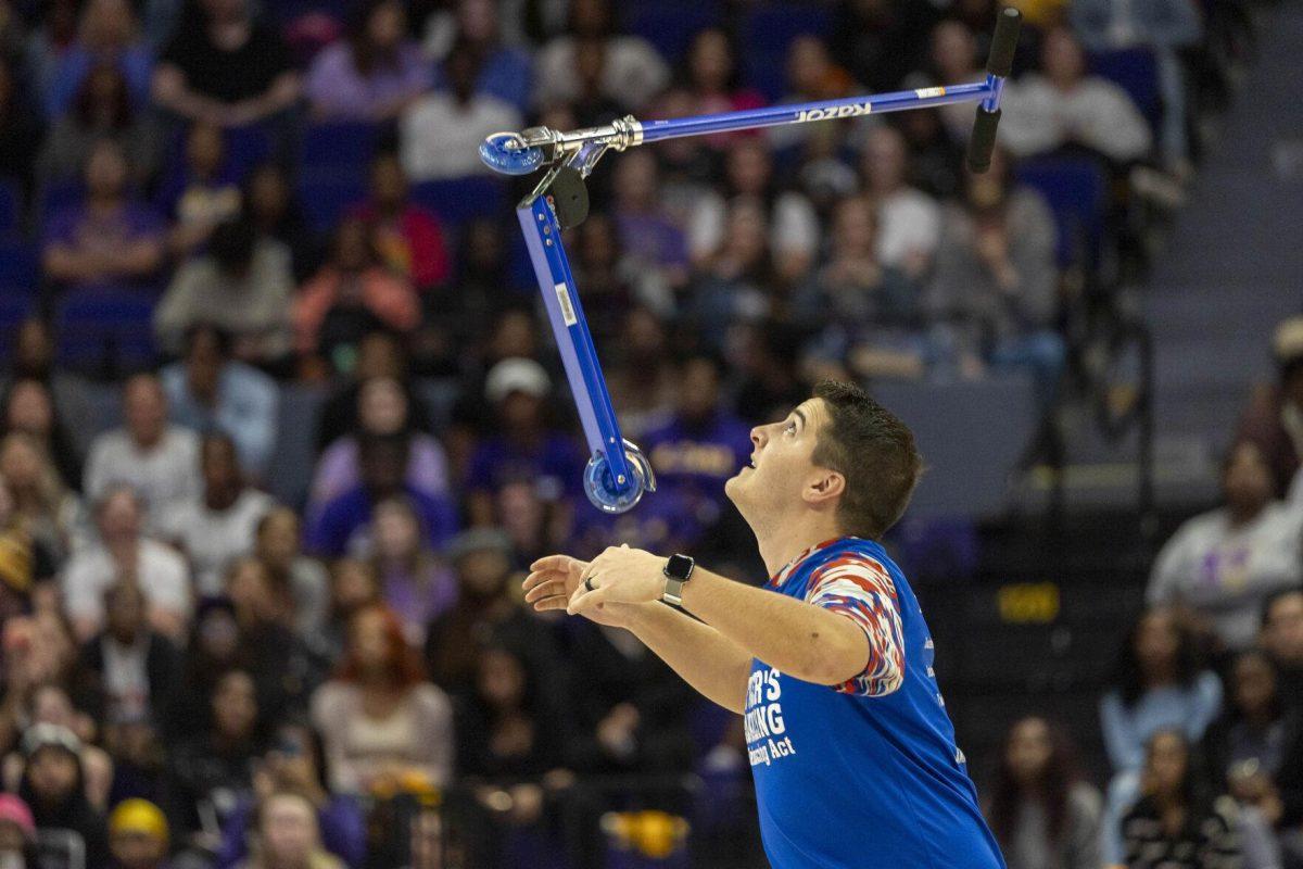 Tyler's Amazing Balancing Act Tyler Scheuer attempts to catch a scooter after balancing it on his nose Thursday, Feb. 22, 2024, during halftime of the LSU 71-66 win over Auburn Pete Maravich Assembly Center in Baton Rouge, La.