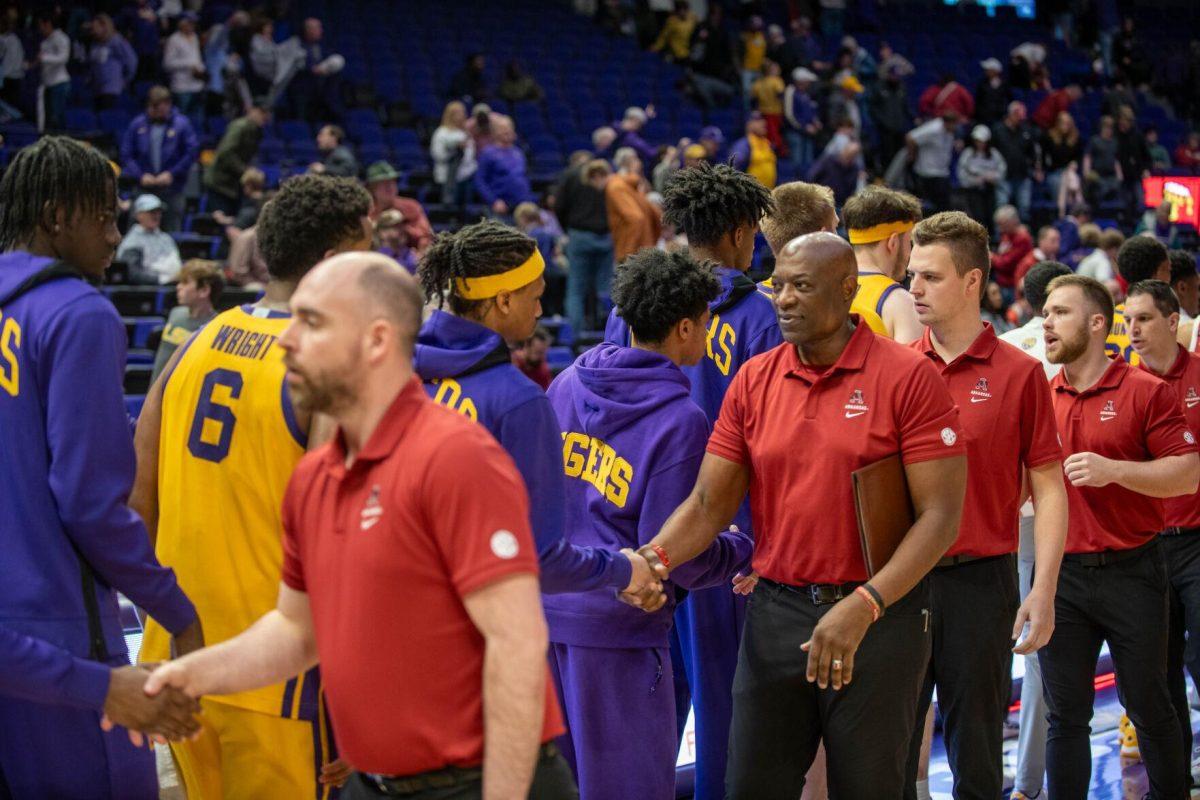 LSU men's Basketball team shakes hands with the Arkansas team and coaches on Saturday, Feb. 3, 2024, after LSU's 94-74 win against Arkansas in the Pete Maravich Assembly Center in Baton Rouge, La.