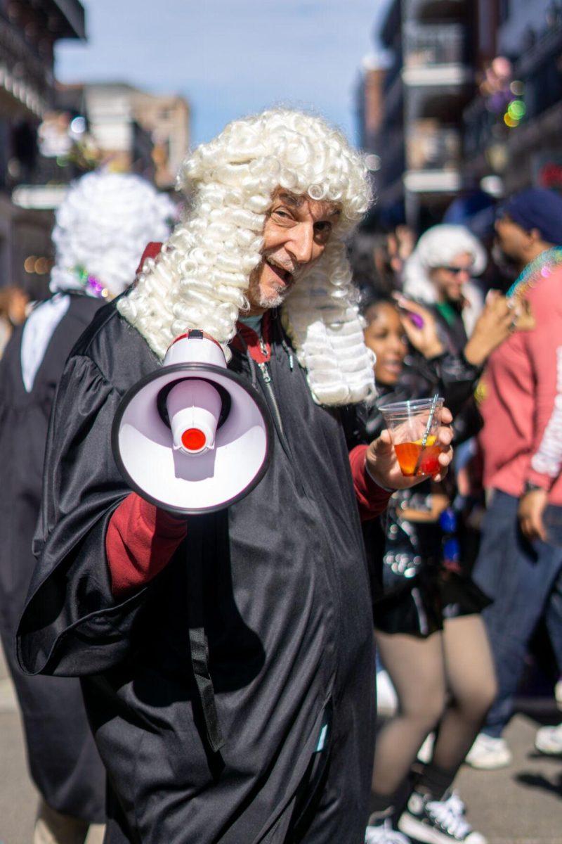 A judge smiles Tuesday, Feb. 13, 2024, on Bourbon Street in New Orleans, La.