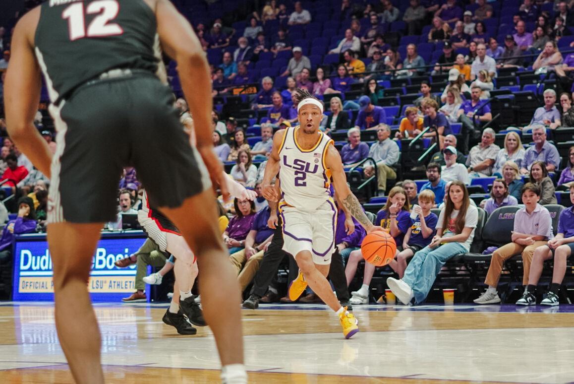 LSU men&#8217;s basketball freshman guard Mike Williams III (2) dribbles the ball Tuesday, Feb. 27, 2024, during LSU&#8217;s game against Georgia in the Pete Maravich Assembly Center in Baton Rouge, La.