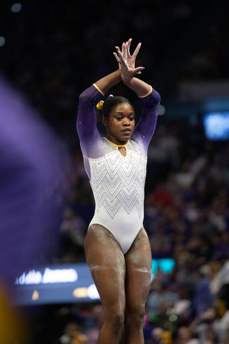 LSU gymnastics all-around graduate student Kiya Johnson poses during her balance beam routine Friday, Feb. 2, 2024, during LSU&#8217;s 198.475-196.200 win against Arkansas at the Pete Maravich Assembly Center in Baton Rouge, La.