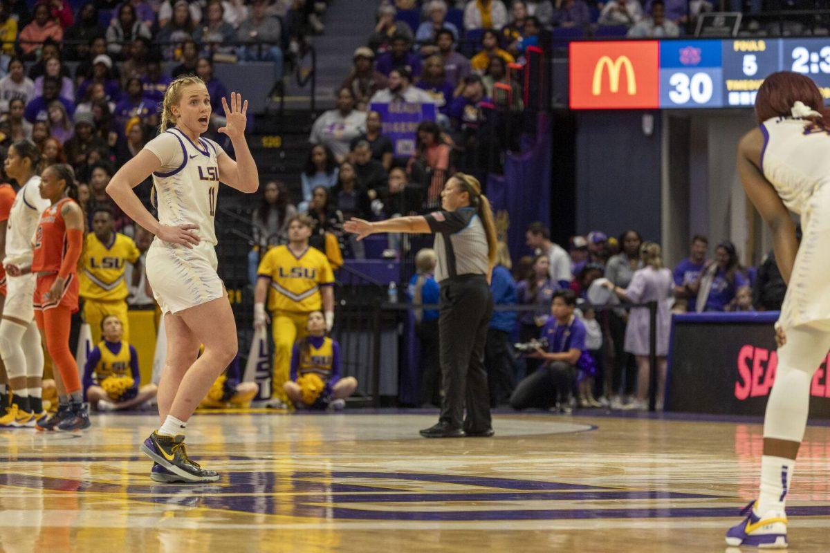 LSU women's basketball graduate student guard Hailey Van Lith (11) tells sophomore guard Flau'jae Johnson (4) to watch Auburn sophomore guard Sydney Shaw (5) Thursday, Feb. 22, 2024, during LSU's 71-66 win over Auburn Pete Maravich Assembly Center in Baton Rouge, La.