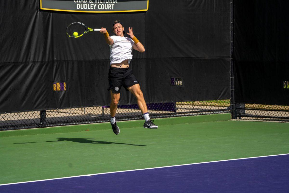 LSU men's tennis junior Julien Penzlin hits a forehand during his 7-6, 6-3 singles win against Rice Sunday, Feb. 4, 2023 at the LSU Tennis Complex on Gourrier Avenue in Baton Rouge, La.