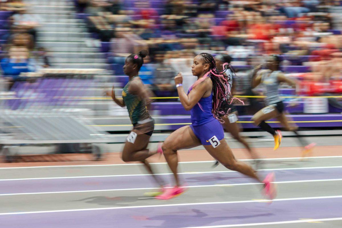 LSU track and field sophomore sprinter Kennedi Sanders zooms by Friday, Feb. 16, 2024, at the LSU Twilight meet in the Carl Maddox Field House in Baton Rouge, La.