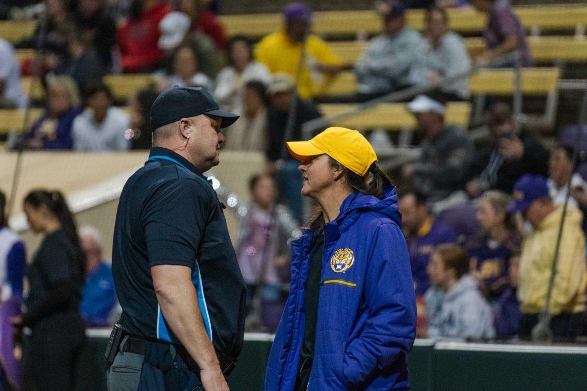 LSU softball head coach Beth Torina speaks with the umpire Thursday, Feb. 8, 2024, during LSU&#8217;s 8-0 win against Nicholls at Tiger Park in Baton Rouge, La.