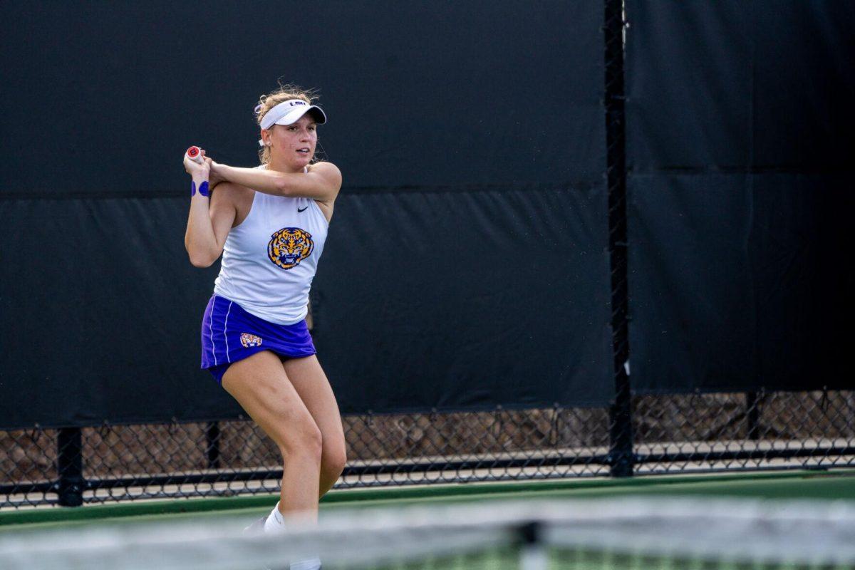 LSU women's tennis freshman Kenna Erickson hits a backhand during her 6-0, 6-4 singles win against Rice Sunday, Feb. 4, 2023 at the LSU Tennis Complex on Gourrier Avenue in Baton Rouge, La.