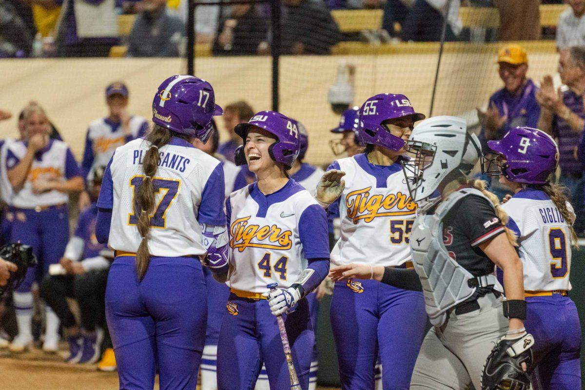 The LSU softball team celebrates graduate student infielder Taylor Pleasants' (17) inside-the-park grand slam Thursday, Feb. 8, 2024, during LSU&#8217;s 8-0 win against Nicholls at Tiger Park in Baton Rouge, La.