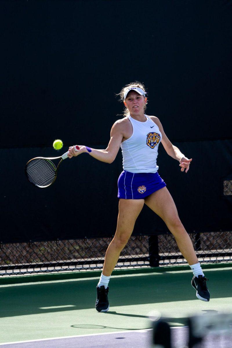 LSU women's tennis freshman Kenna Erickson hits a forehand during her 6-0, 6-4 singles win against Rice Sunday, Feb. 4, 2023 at the LSU Tennis Complex on Gourrier Avenue in Baton Rouge, La.