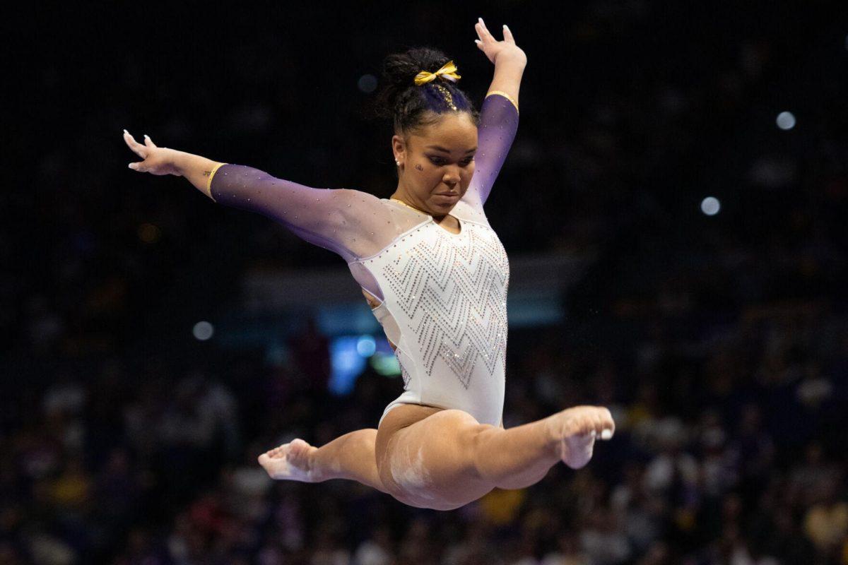 LSU gymnastics all-around freshman Konner McClain performs a split in the air Friday, Feb. 2, 2024, during LSU&#8217;s 198.475-196.200 win against Arkansas at the Pete Maravich Assembly Center in Baton Rouge, La.