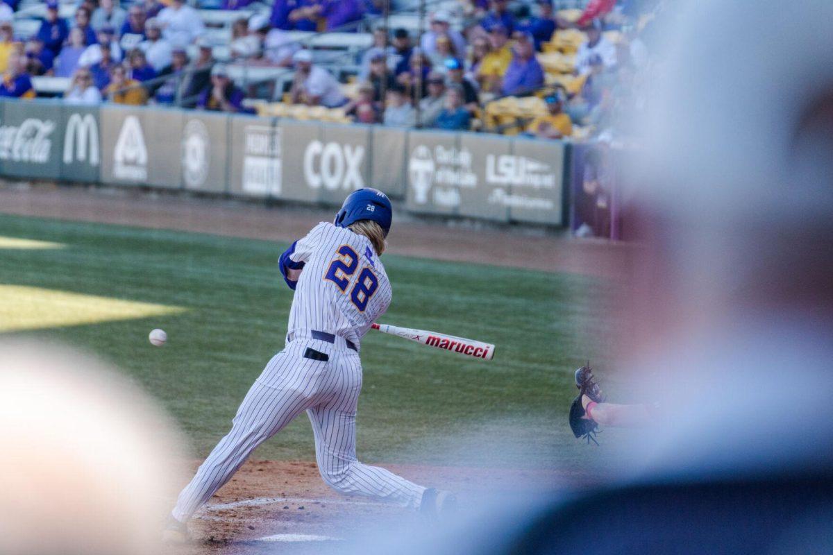 LSU baseball sophomore outfielder Paxton Kling (28) swings at the ball Friday, Feb. 23, 2024, during LSU&#8217;s 5-2 loss against Stony Brook at Alex Box Stadium in Baton Rouge, La.