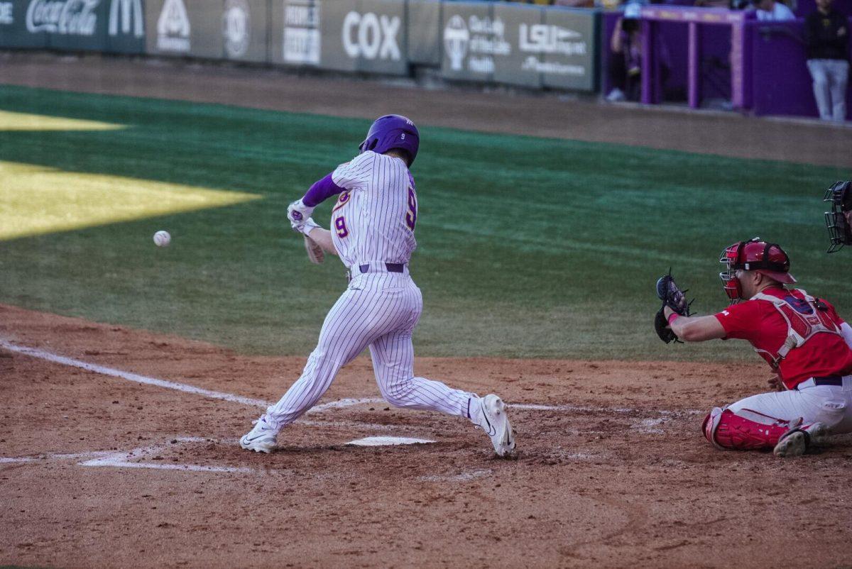 LSU baseball senior outfielder Mac Bingham (9) swings for the ball Friday, Feb. 23, 2024, during LSU&#8217;s game against Stony Brook at Alex Box Stadium in Baton Rouge, La.