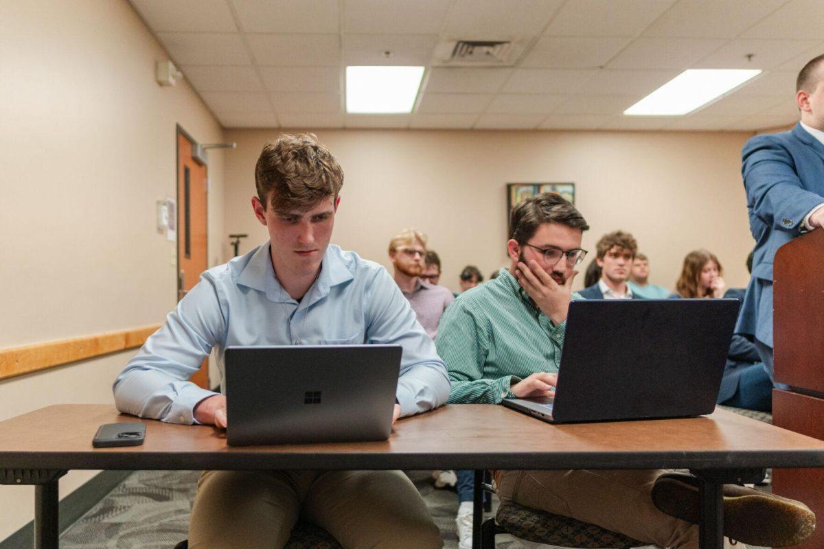 John Michael Sweat and Cooper Ferguson listen to John-Michael Shiner's rebuttal Monday, March 25, 2024, inside the LSU Student Union.