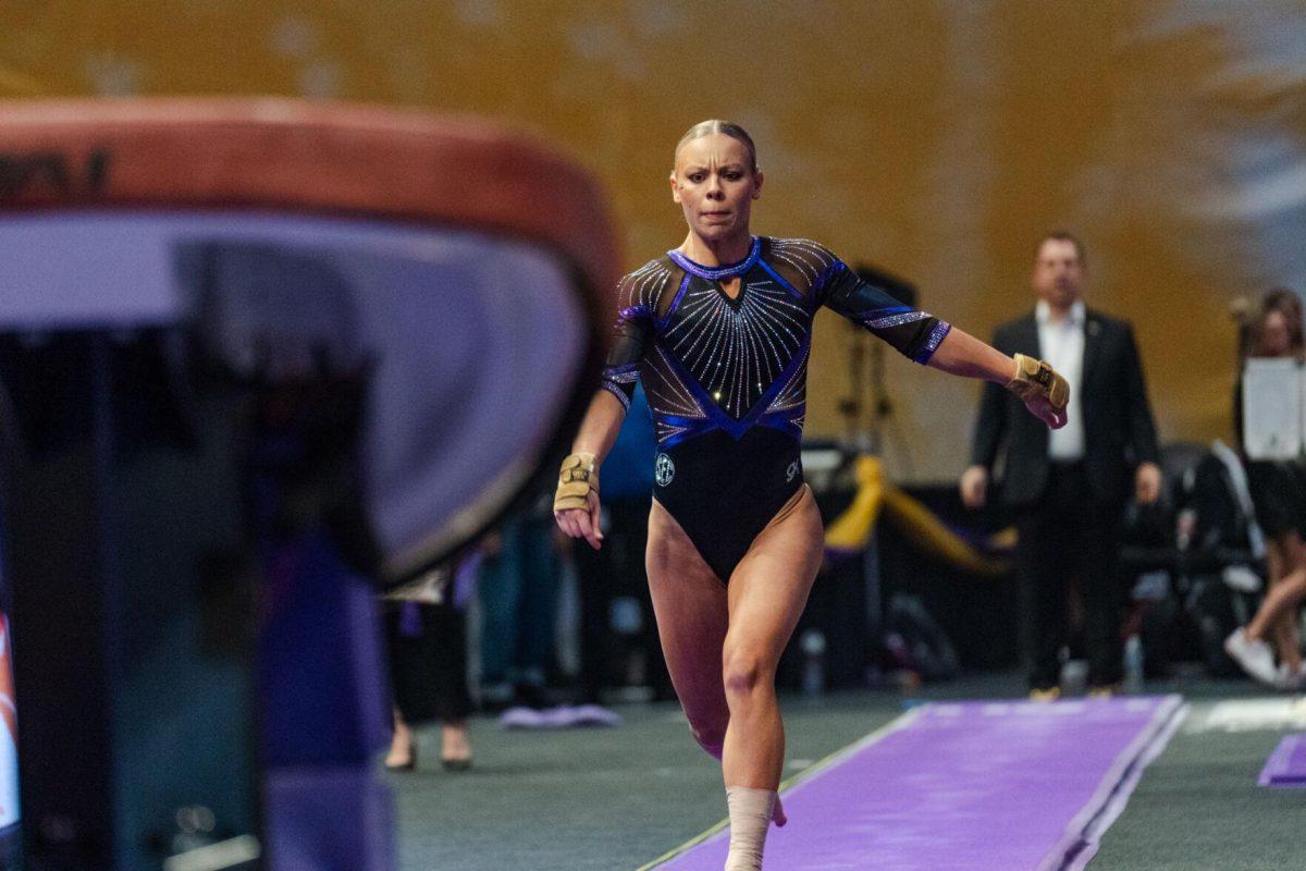 LSU gymnastics vault/uneven bars/floor exercise senior Chase Brock runs down the runway Friday, March 1, 2024, during LSU&#8217;s 198.325-197.325 win against Alabama in the Pete Maravich Assembly Center in Baton Rouge, La.