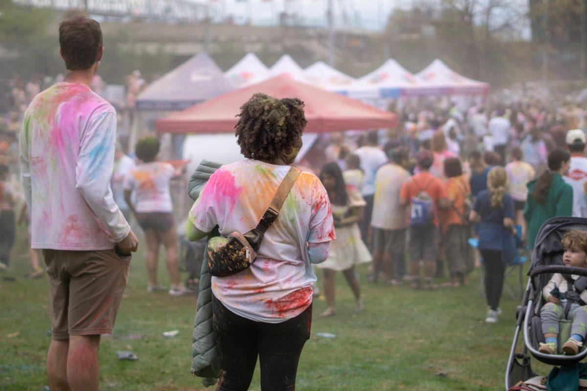 Holi festival participants throw powder Saturday, March 9, 2024, at the Holi Festival at Repentance Park in Baton Rouge La.