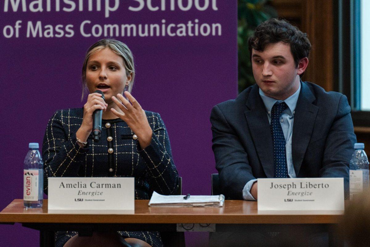 Amelia Carman answers a question as Joseph Liberto listens Monday, March 18, 2024, inside the Holliday Forum at LSU in Baton Rouge, La.