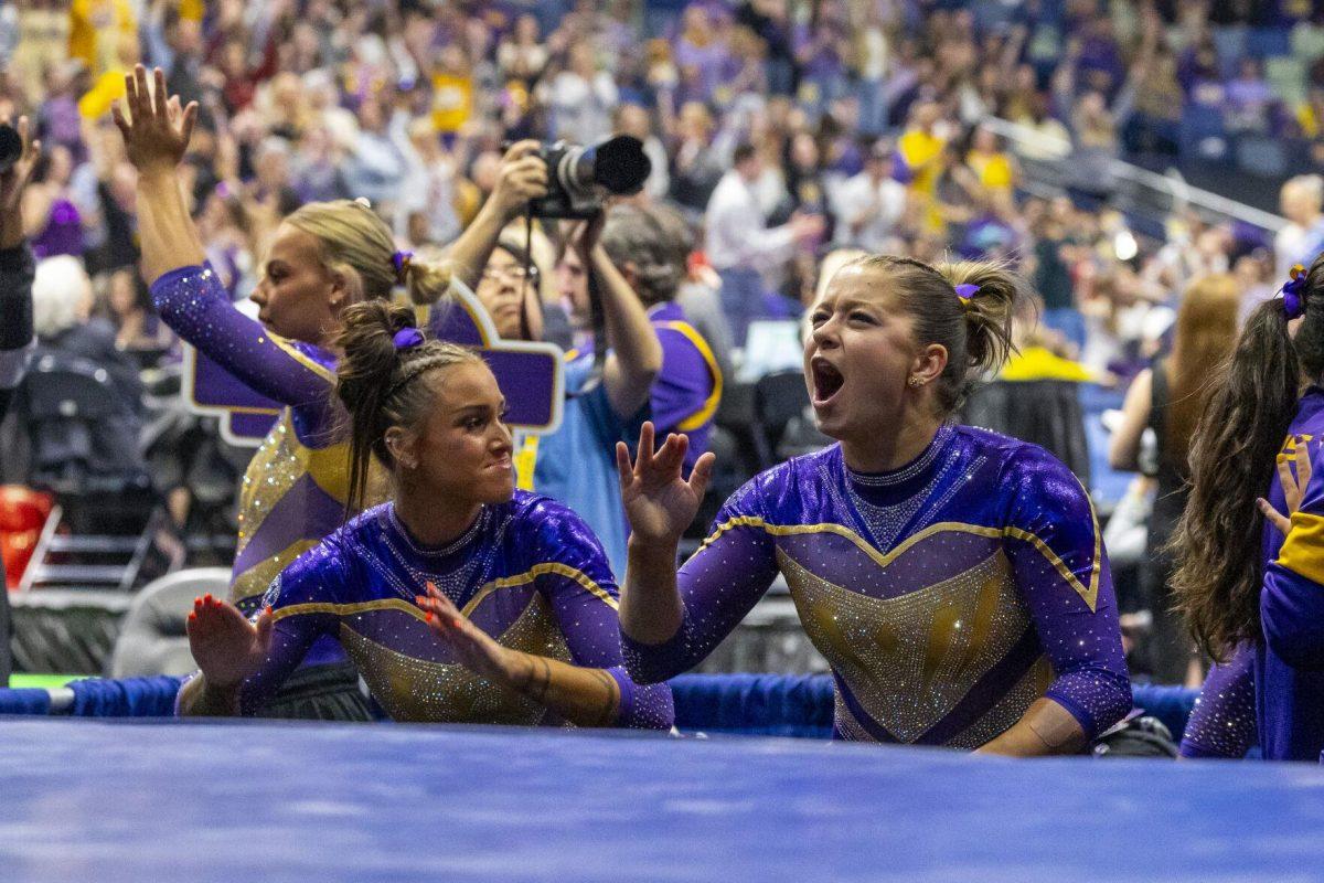 LSU gymnastics sophomore all-around Ashley Cowan hypes up the crowd following Konnor McClain's 10 Saturday, March 23, 2024, during LSU's 198.075 victory in the 2024 SEC Gymnastics Championship in the Smoothie King Center in New Orleans, La.
