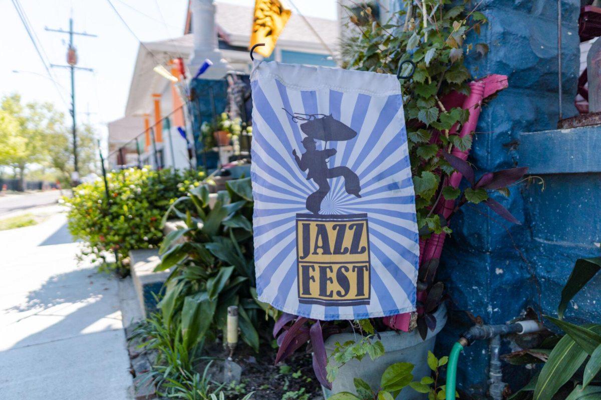 A Jazz Fest banner hangs in front of a home Friday, March 29, 2024, on Fortin Street in New Orleans, La.