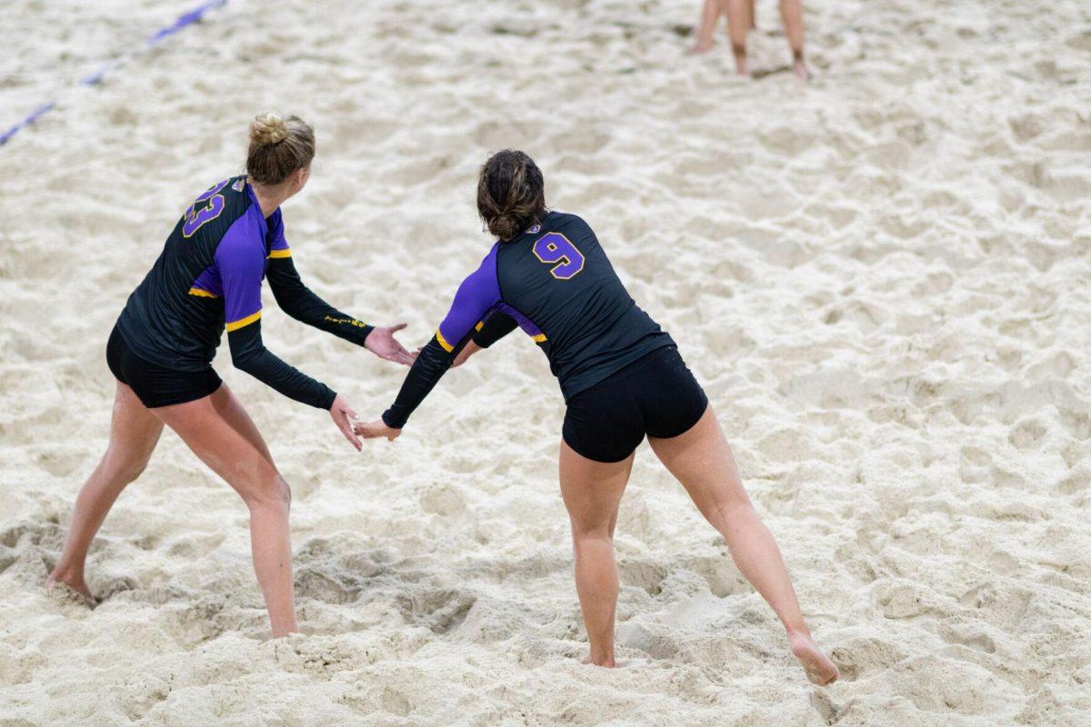 LSU beach volleyball freshman Skylar Martin (9) and freshman Amelia Taft (23) celebrate Saturday, March 2, 2024, during LSU's 5-0 win against Nebraska at the LSU Beach Volleyball Stadium in Baton Rouge, La.