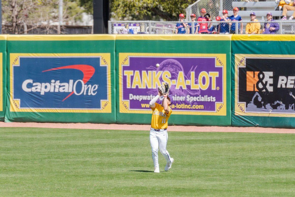 LSU baseball junior outfielder Josh Pearson (11) catches a fly ball Sunday, March 10, 2024, during LSU's 2-1 loss to Xavier in Alex Box Stadium in Baton Rouge, La.