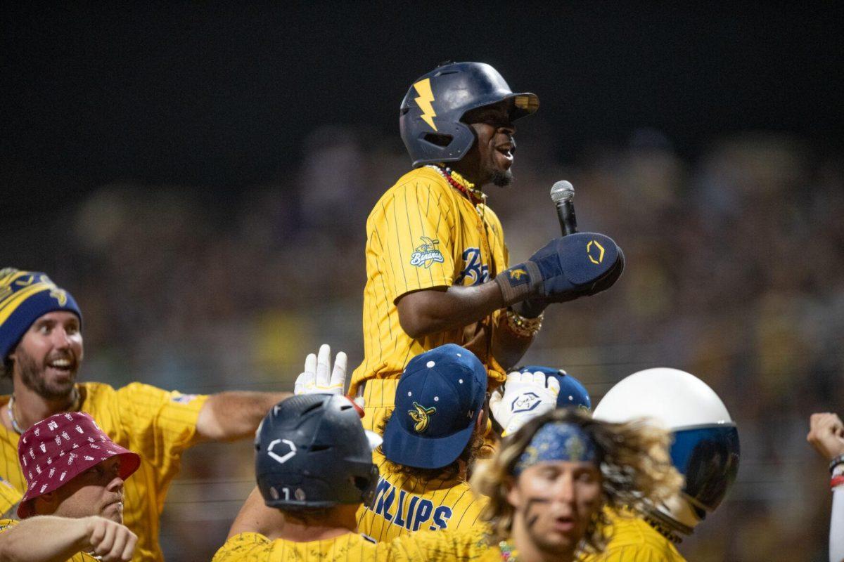 Savannah Bananas runner Malachi "Flash Tha Kid" Mitchell celebrates a home run Thursday, March 14, 2024, during the Savannah Bananas 5-4 loss to the Party Animals during their world tour stop at Alex Box Stadium in Baton Rouge, La.