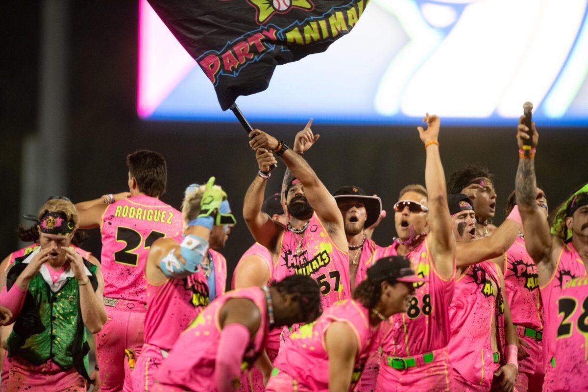 The Party Animals celebrate their win Thursday, March 14, 2024, after the Savannah Bananas 5-4 loss to the Party Animals during their world tour stop at Alex Box Stadium in Baton Rouge, La.