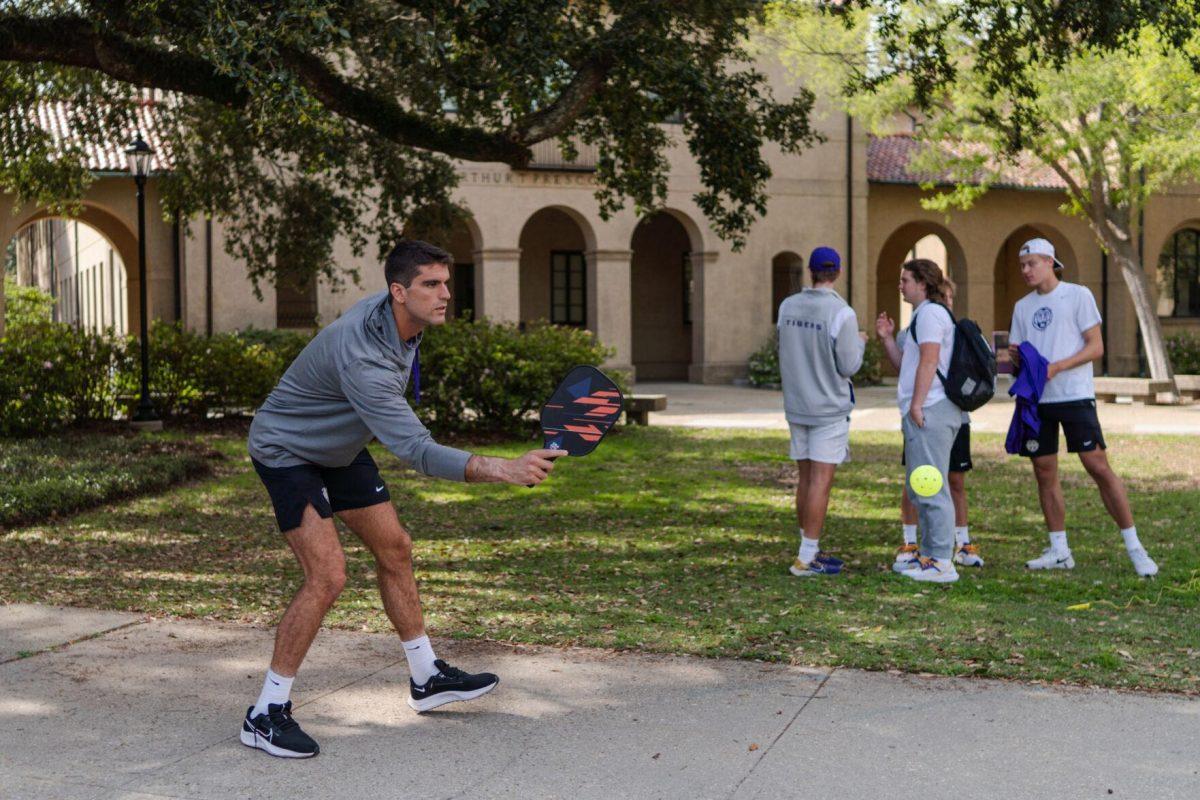 LSU men's tennis 5th-year senior Stefan Latinovic hits the ball Thursday, March 7, 2024, in the Quad on LSU's campus in Baton Rouge, La.