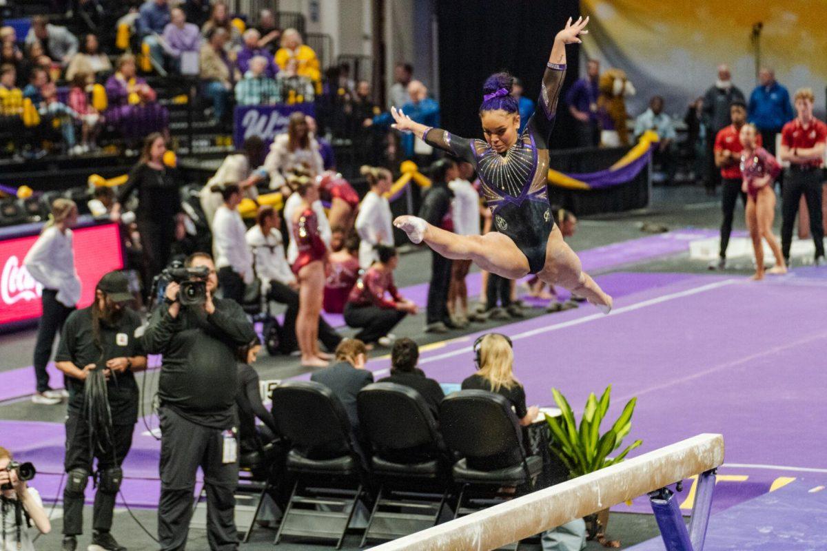 LSU gymnastics all-around freshman Konnor McClain moves through the air Friday, March 1, 2024, during LSU&#8217;s 198.325-197.325 win against Alabama in the Pete Maravich Assembly Center in Baton Rouge, La.