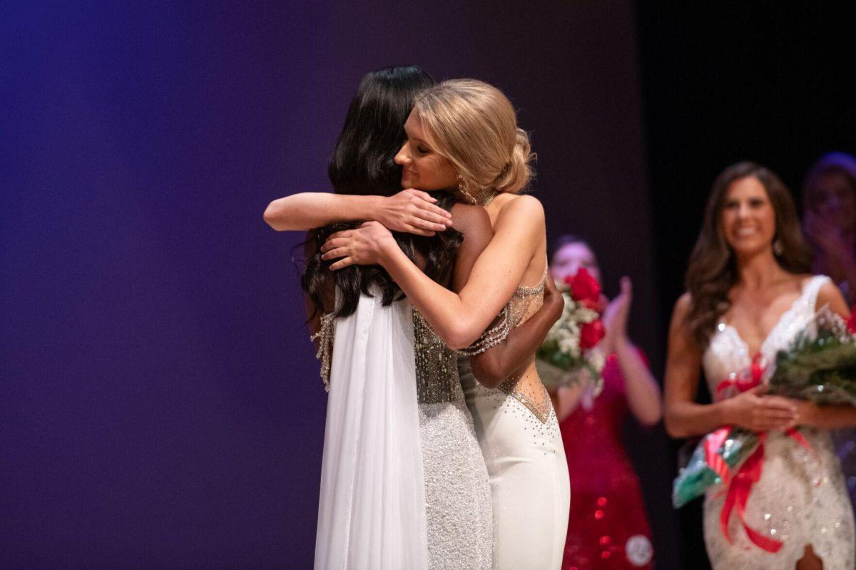 LSU first-year law student Jillian Coco hugs kinesiology sophomore Nikhia Sims after Sims wins Sunday, March 24, 2024, during Delta Zeta's Miss LSU 2024 Pageant in the Union Theater in Baton Rouge, La.