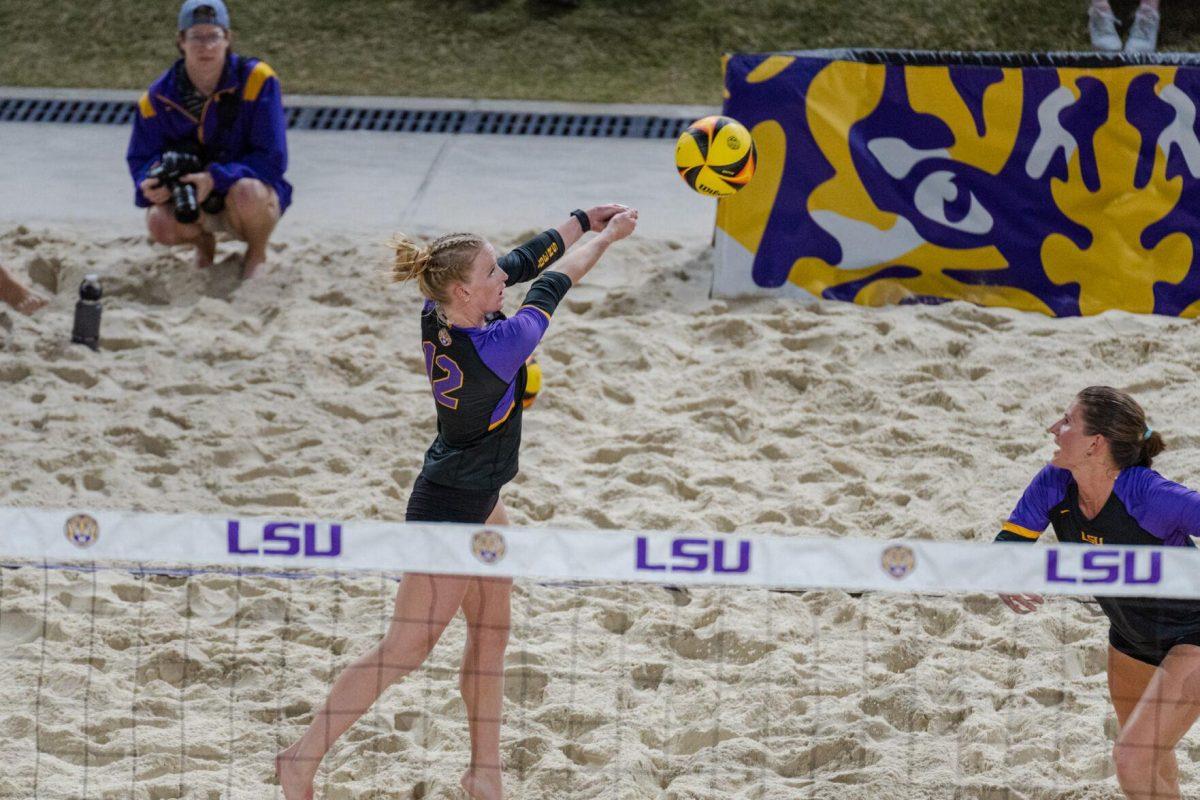 LSU beach volleyball senior Amber Haynes (12) hits the ball Saturday, March 2, 2024, during LSU&#8217;s 5-0 win against Nebraska at the LSU Beach Volleyball Stadium in Baton Rouge, La.