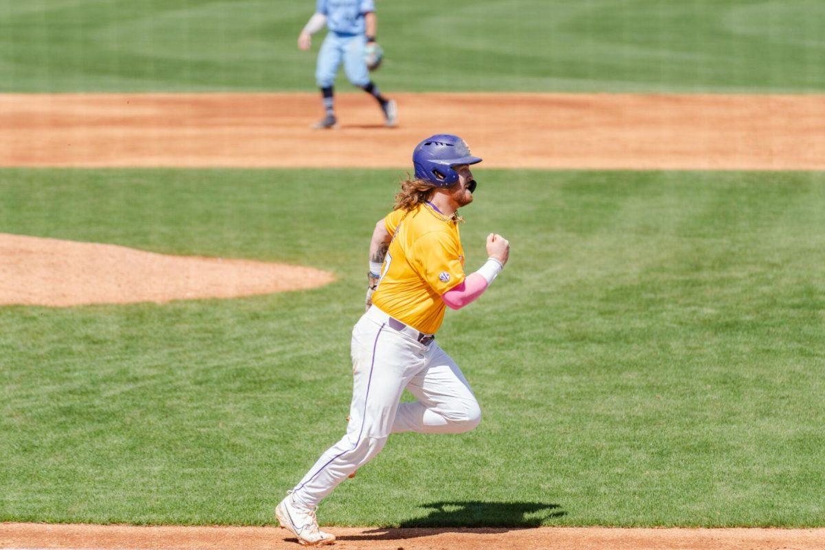 LSU baseball junior third baseman Tommy White (44) runs to first base Sunday, March 10, 2024, during LSU's 2-1 loss to Xavier in Alex Box Stadium in Baton Rouge, La.