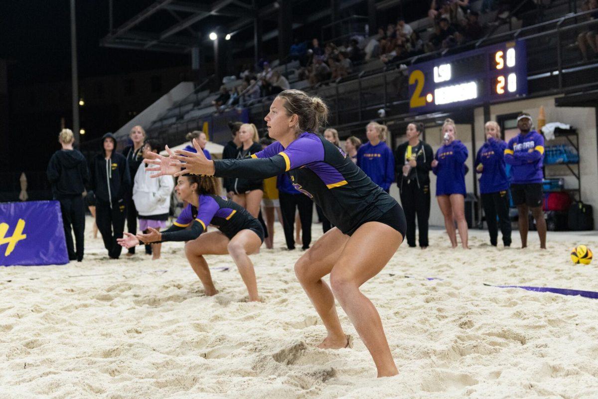 LSU beach volleyball senior Emily Meyer (25) prepares for a serve Saturday, March 2, 2024, during LSU's 5-0 win against Nebraska at the LSU Beach Volleyball Stadium in Baton Rouge, La.