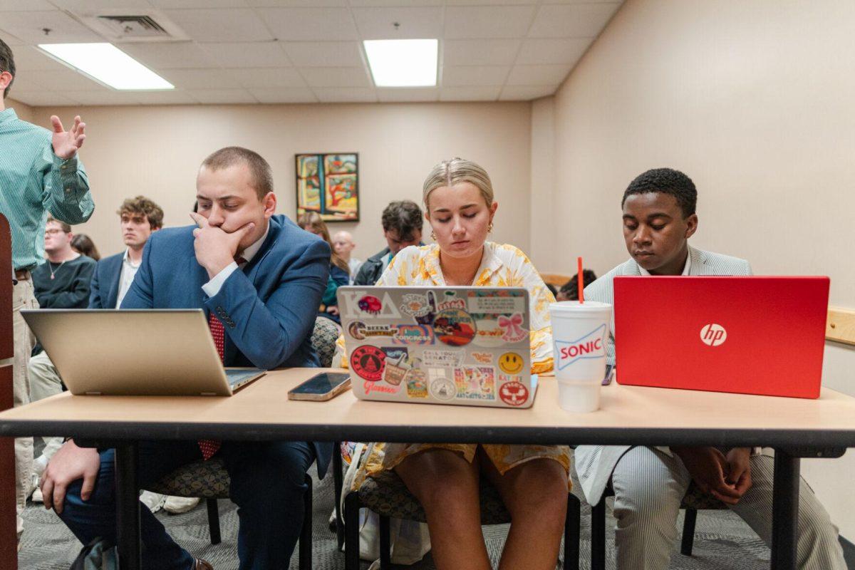 John-Michael Shiner, Anna Kate Jackson and Lavar Henderson listen to Cooper Ferguson's statements Monday, March 25, 2024, inside the LSU Student Union.