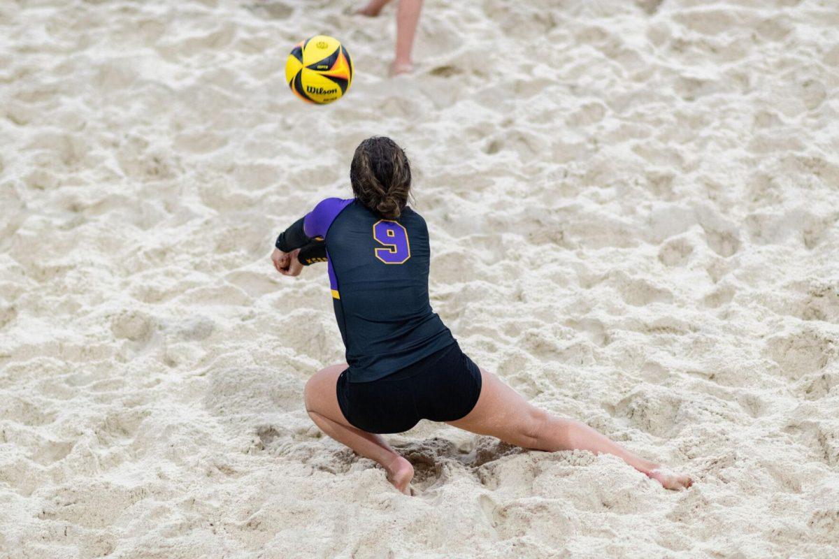 LSU beach volleyball freshman Skylar Martin (9) lunges for the ball Saturday, March 2, 2024, during LSU's 5-0 win against Nebraska at the LSU Beach Volleyball Stadium in Baton Rouge, La.