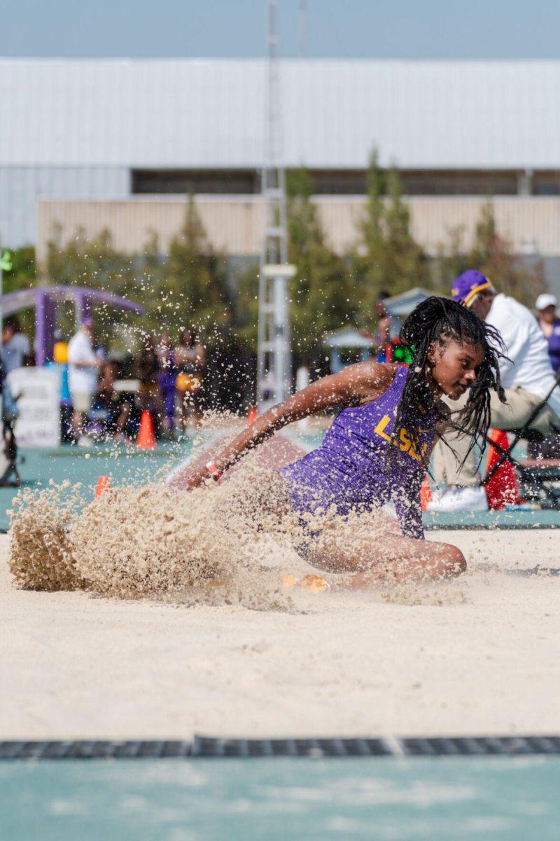 LSU track and field jumps senior Morgan Smalls lands in the snad Saturday, March 23, 2024, during the Keyth Talley Invitational at the Bernie Moore Track Stadium in Baton Rouge, La.