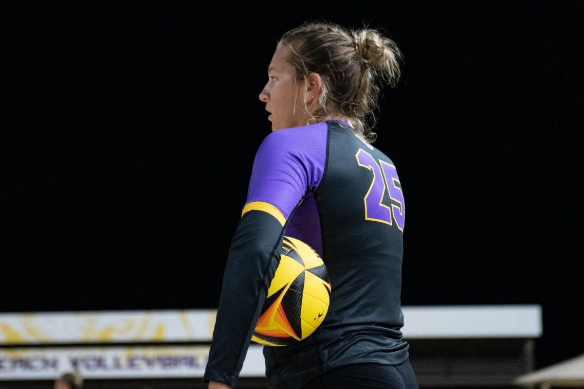 LSU beach volleyball senior Emily Meyer (25) holds the ball Saturday, March 2, 2024, during LSU's 5-0 win against Nebraska at the LSU Beach Volleyball Stadium in Baton Rouge, La.